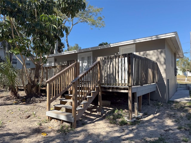 rear view of house featuring a deck