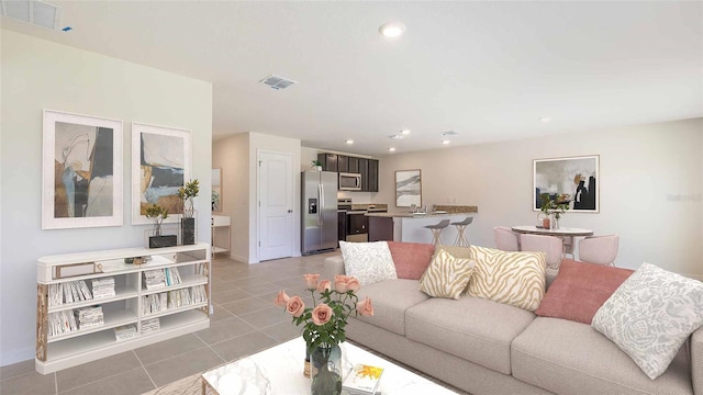 living room featuring light tile patterned floors