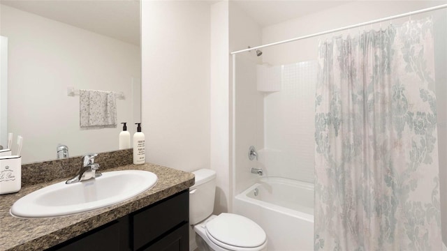 full bathroom with vanity, shower / tub combo, and toilet