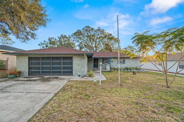 single story home with a garage and a front lawn