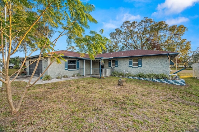 rear view of property featuring a yard