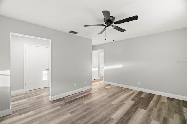 unfurnished bedroom with ceiling fan and light wood-type flooring