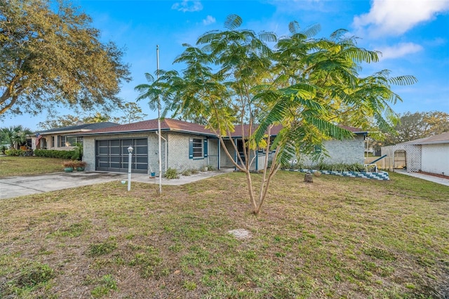 view of front of house with a garage and a front lawn