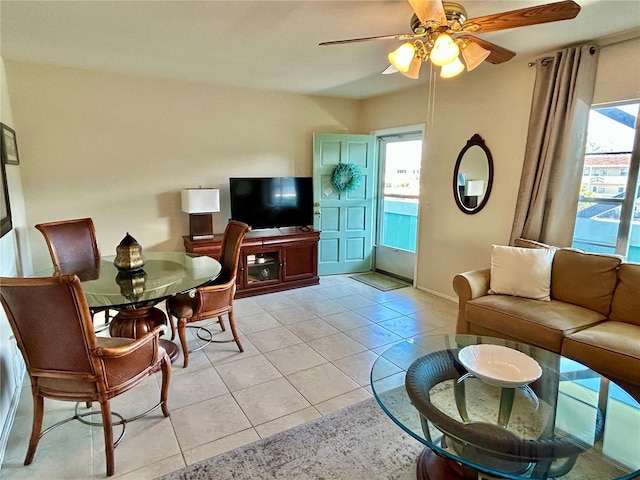 living room with ceiling fan and light tile patterned flooring