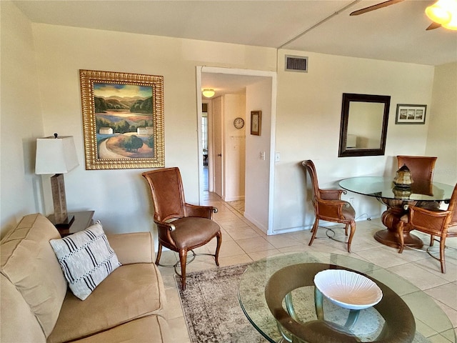 tiled living room featuring ceiling fan