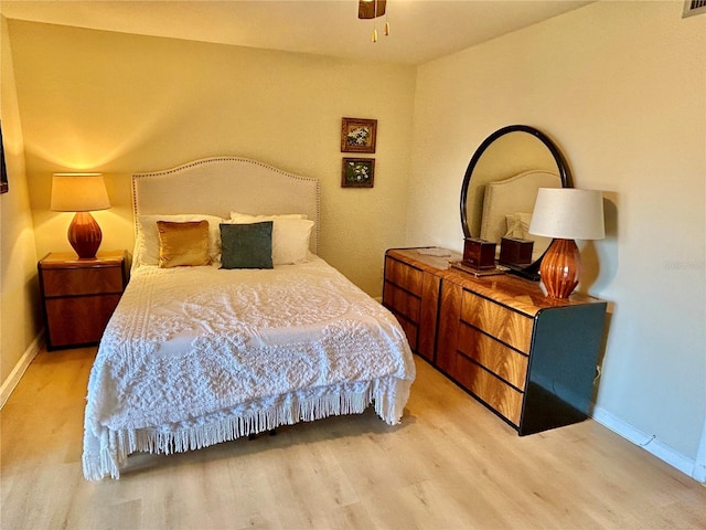 bedroom featuring ceiling fan and wood-type flooring