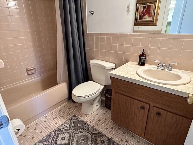 full bathroom with toilet, vanity, tile patterned flooring, tile walls, and shower / bath combination with curtain