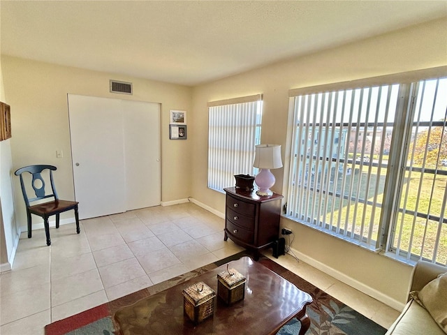 living area featuring light tile patterned floors