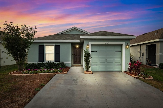 ranch-style home featuring a garage