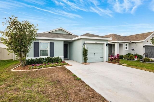 ranch-style house with a garage and a front lawn