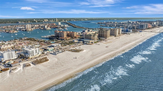 aerial view featuring a water view, a view of city, and a view of the beach