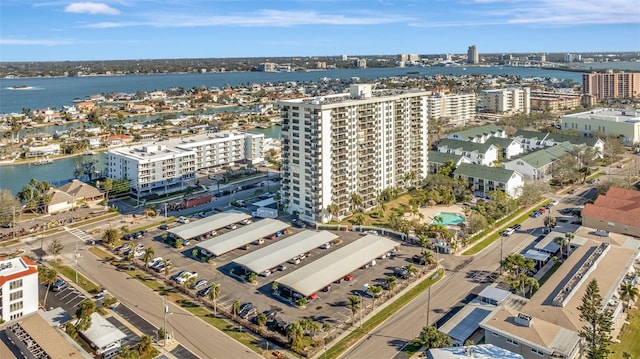 birds eye view of property featuring a water view and a city view