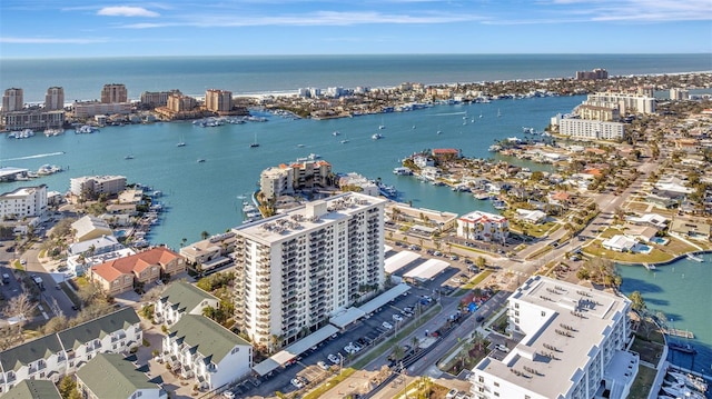 birds eye view of property with a view of city and a water view