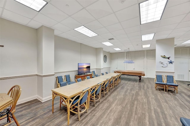 dining space with baseboards, visible vents, dark wood finished floors, and a drop ceiling