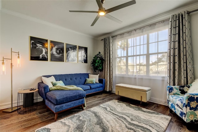 living area featuring ornamental molding, ceiling fan, and dark hardwood / wood-style flooring