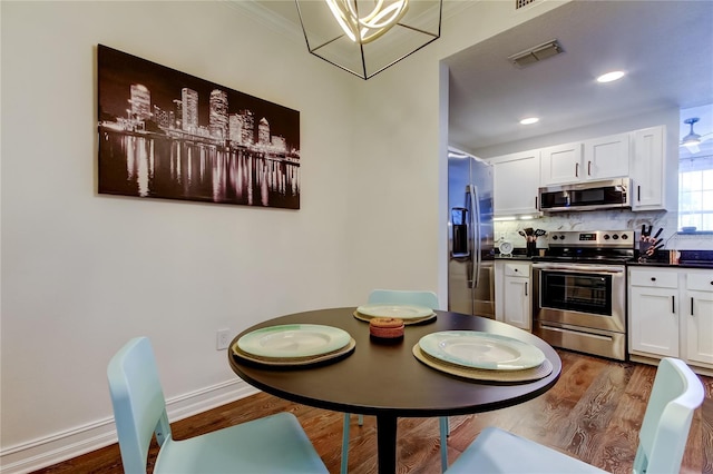 dining space featuring dark hardwood / wood-style floors