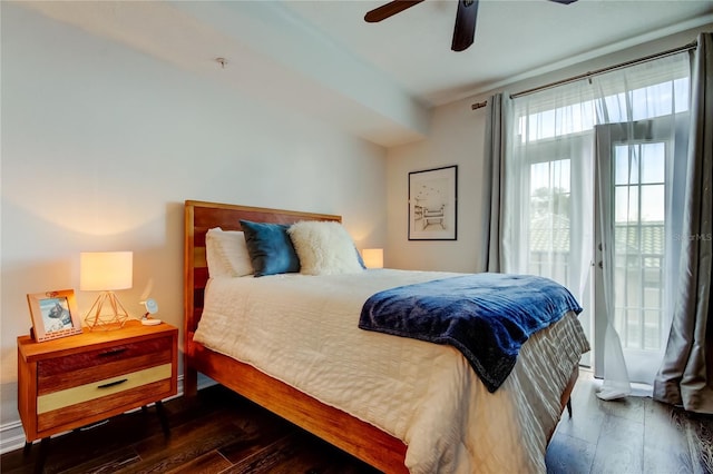 bedroom featuring dark hardwood / wood-style flooring, access to exterior, and ceiling fan