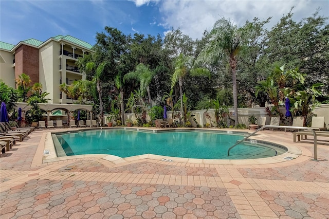 view of swimming pool with a patio