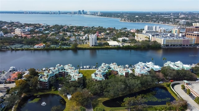 birds eye view of property with a water view