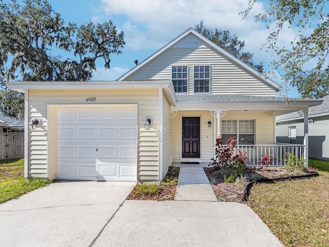 view of front of property featuring a garage and covered porch