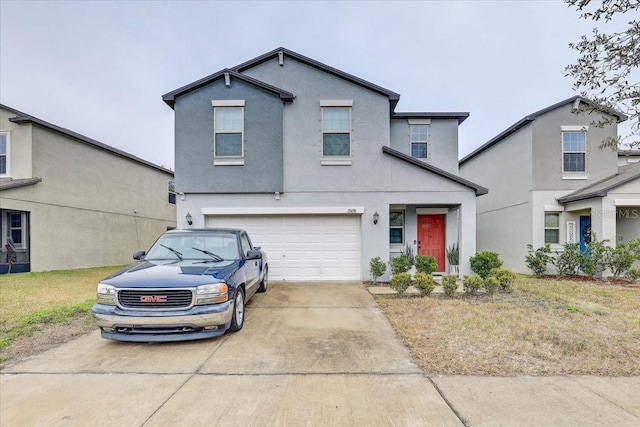 front facade with a garage and a front lawn