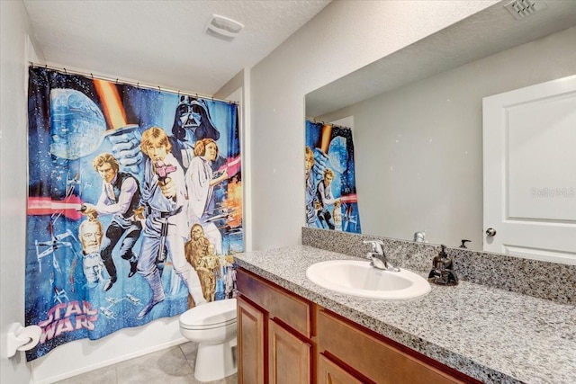 full bathroom featuring tile patterned flooring, vanity, toilet, shower / bathtub combination with curtain, and a textured ceiling