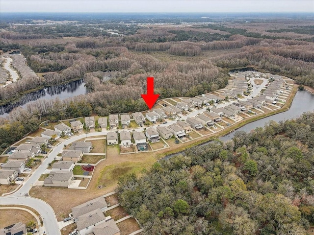 birds eye view of property featuring a water view