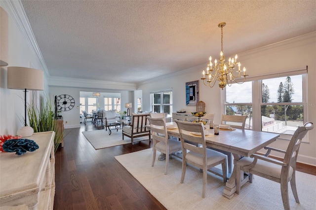 dining area with a wealth of natural light, dark wood-type flooring, and a textured ceiling