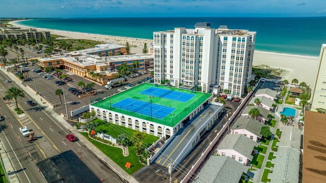 bird's eye view featuring a water view and a beach view