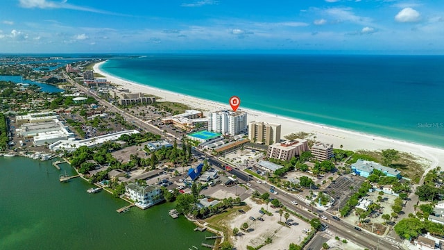 aerial view with a water view and a view of the beach