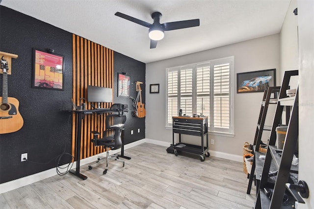 office space with plenty of natural light, light wood-type flooring, and ceiling fan