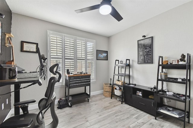 office area with ceiling fan and light wood-type flooring