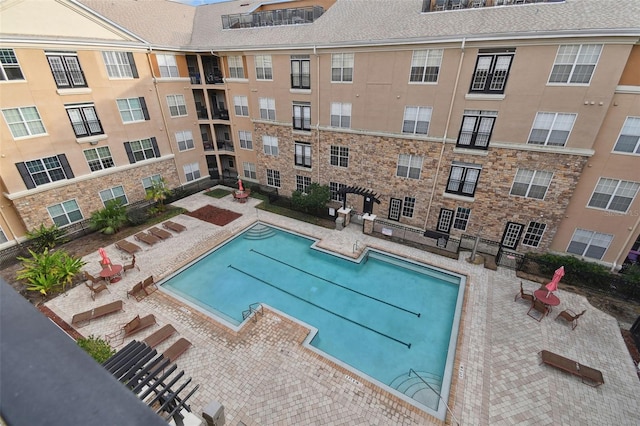 view of swimming pool with a patio