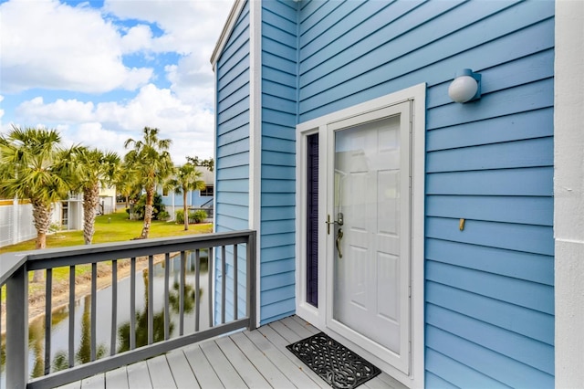 view of exterior entry featuring a water view