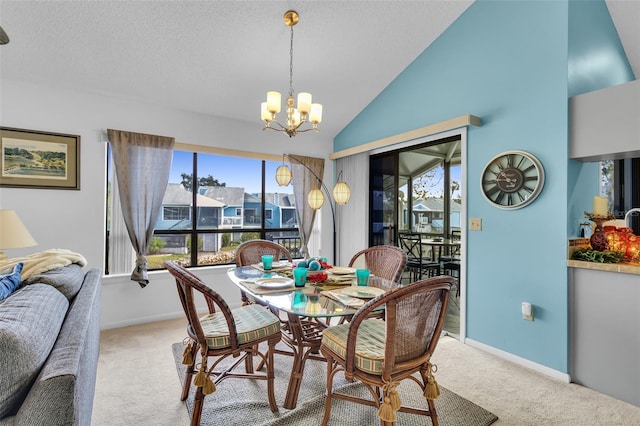 dining area featuring a notable chandelier, vaulted ceiling, a textured ceiling, and light carpet