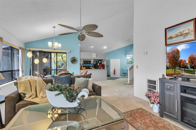 living room featuring ceiling fan with notable chandelier, light colored carpet, a textured ceiling, and lofted ceiling