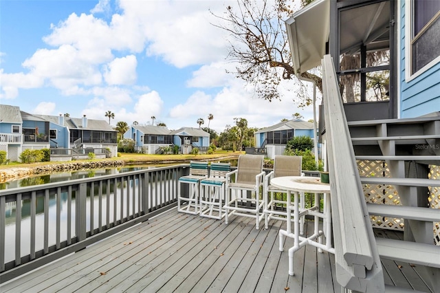 wooden deck with a water view