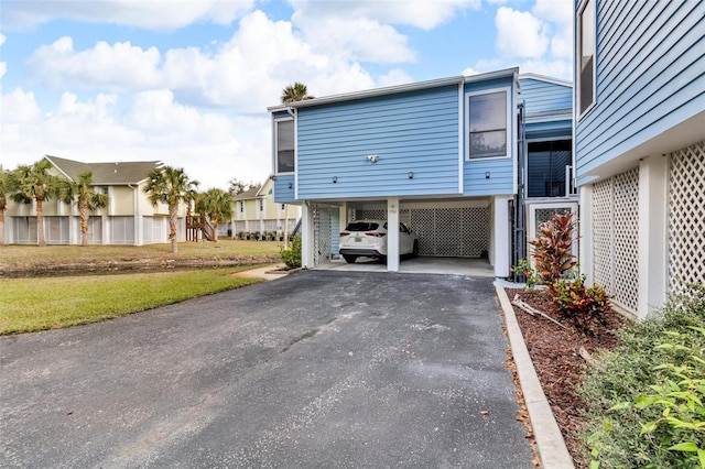 view of home's exterior featuring a carport