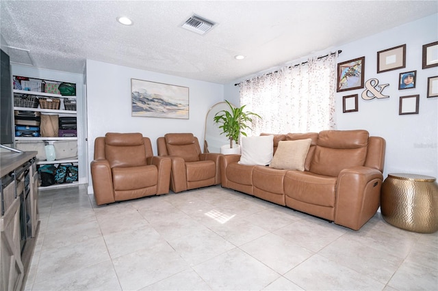 tiled living room with a textured ceiling