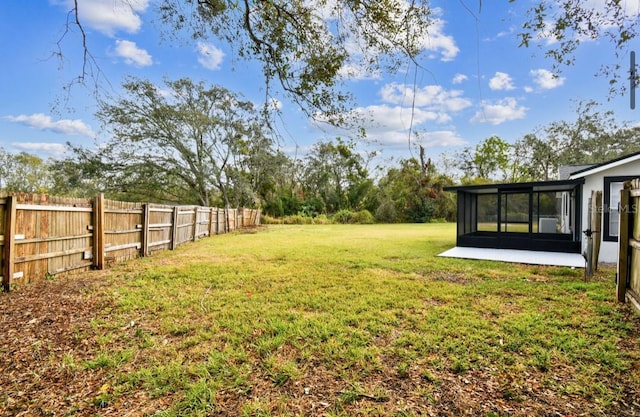 view of yard featuring a sunroom