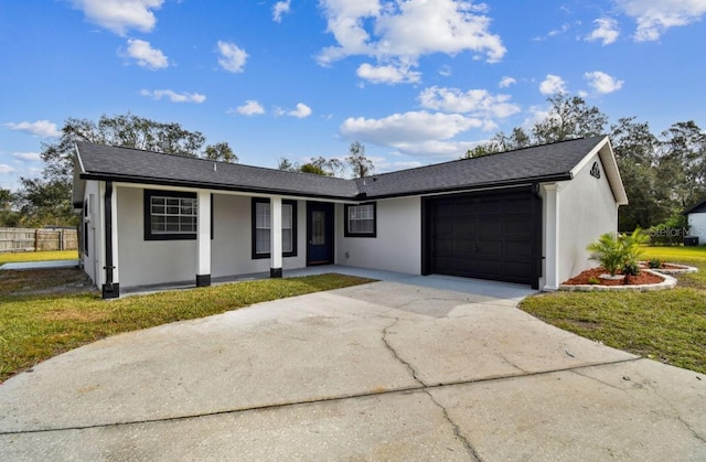 ranch-style home featuring a front lawn and a garage