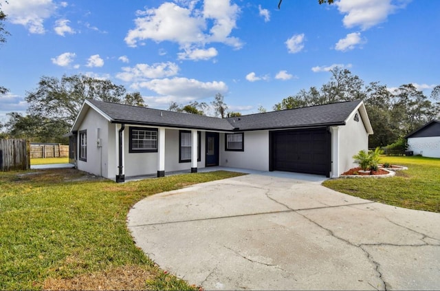 single story home with a front yard and a garage