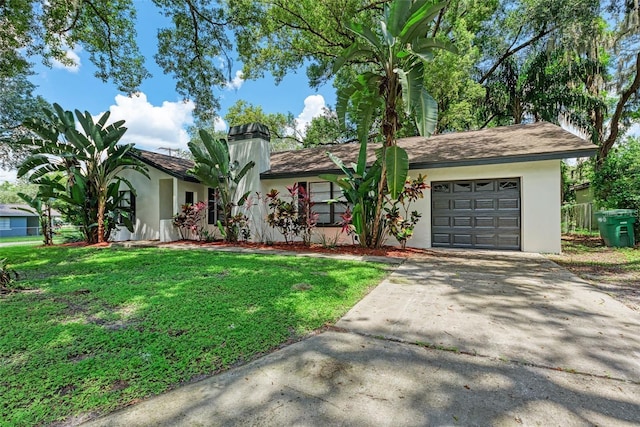 ranch-style home featuring a garage and a front yard