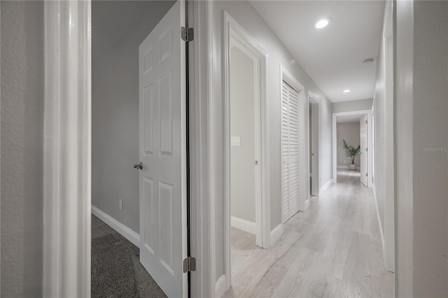 hall with light hardwood / wood-style floors