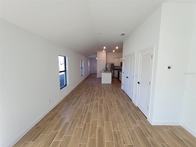 interior space featuring vaulted ceiling