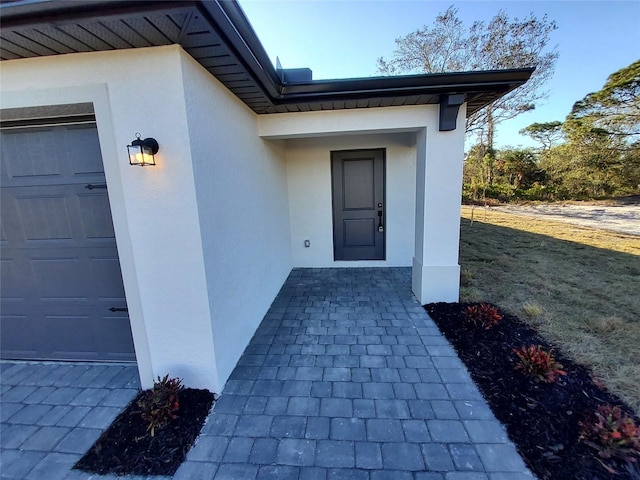 property entrance with a garage