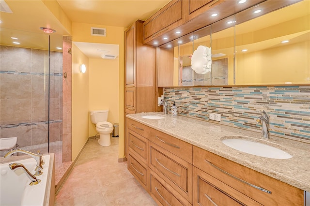 full bathroom with decorative backsplash, toilet, vanity, and separate shower and tub