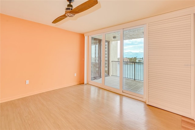 spare room featuring hardwood / wood-style flooring and ceiling fan