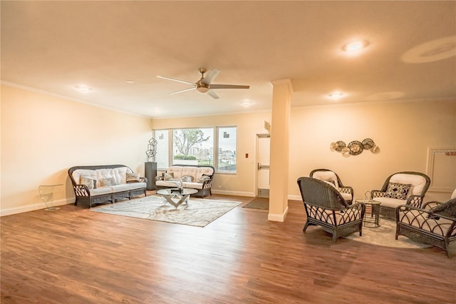 living room with crown molding, hardwood / wood-style floors, decorative columns, and ceiling fan