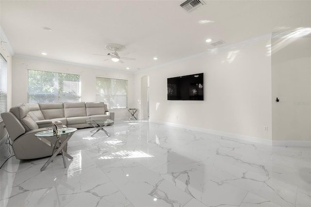 living room featuring ceiling fan and crown molding